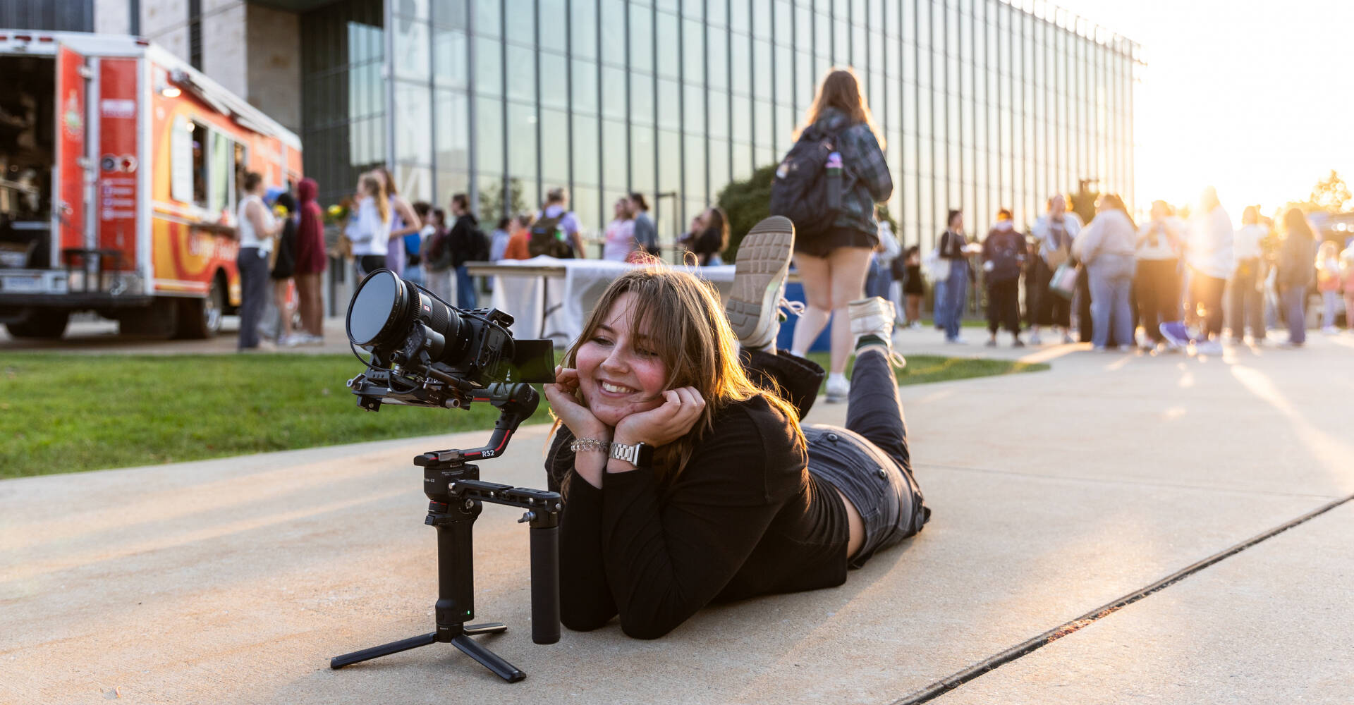 Person filming the clocktower with a smile